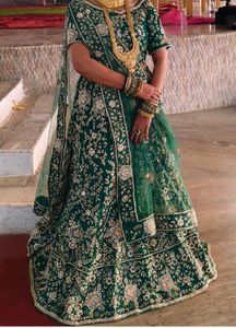 green lehanga eith blause and duptta jardoshi work