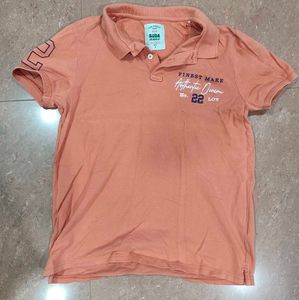 Orange Polo Shirt with "Finest Make" Print