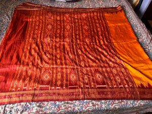 Vibrant Orange and Red Ikat Saree