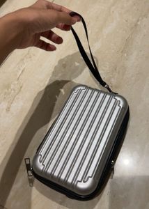 Convertible Silver Mini Luggage Style Clutch.