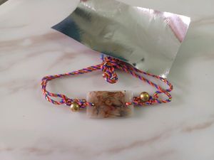 floral resin rakhi in rectangle shape