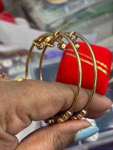 Elegant Gold Toned Earrings with Red Stones