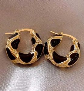 Chic Gold & Black Hoop Earrings