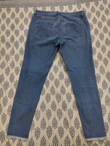 Distressed Blue Narrow Jeans