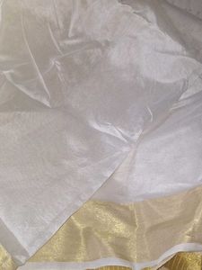 Elegant White and Gold Saree Onam
