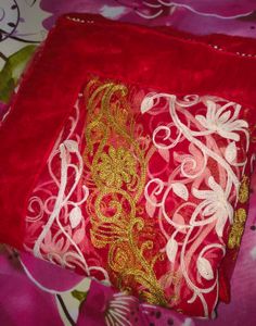 Net embroidery red saree with stitched blouse