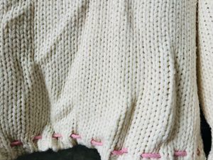 Cozy Cream Knit Sweater with Pink Accents