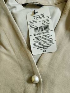 Elegant Beige Wrap Top with Pearl Button