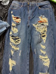 Distressed Blue Denim Jeans
