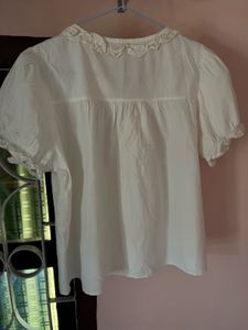 Cream Ruffled Button-Up Blouse