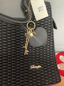 Stylish Black Handbag with Heart Handle