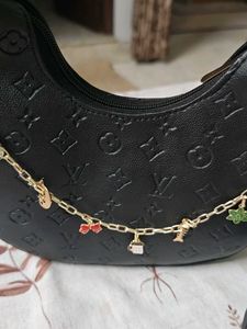 Chic Black Embossed Hobo Bag with Charms