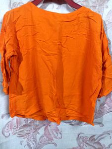 Vibrant Orange Kurta with Floral Embellishments