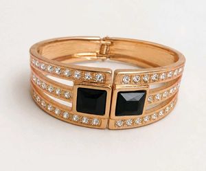 Elegant Rose Gold Bangle with Black Stones