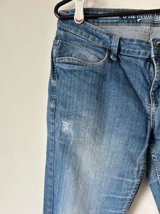 Women's Blue Distressed Jeans with Patch