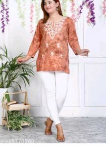 Embroidered Orange Kurti with White Pants