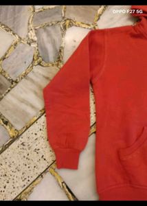 23. Red Zip-Up Hoodie with Paisley Design