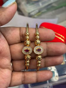 Elegant Gold Toned Earrings with Red Stones