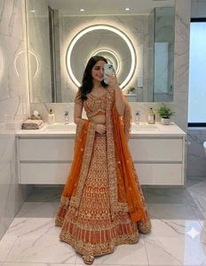 Stunning Orange Embroidered Lehenga Choli