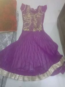 Elegant Purple Gown with Gold Embellishments