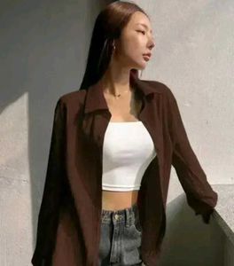 brown shirt with black buttons