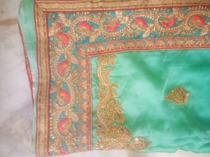 Elegant Teal Saree with Gold Embroidery