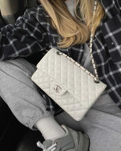 Chanel Classic Flap Bag - Black Lambskin
