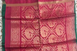 Elegant Teal Saree with Floral Motifs