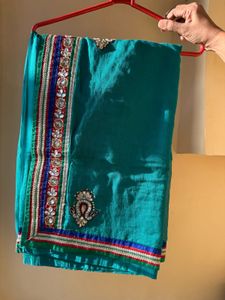 Embellished Teal Super net Saree