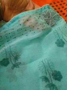 Elegant Teal Saree with Floral Print