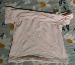 Chic Pink Off-Shoulder Top with Flower Accent