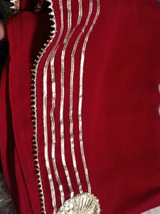 Elegant Red Saree with Gold Embellishments
