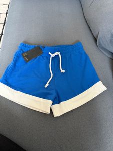 Brand new Blue Athletic Shorts with White Trim
