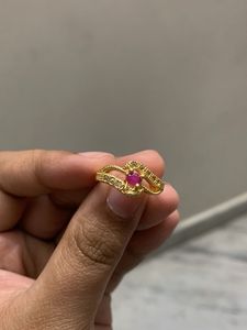 Elegant Gold Ring with Ruby Accent