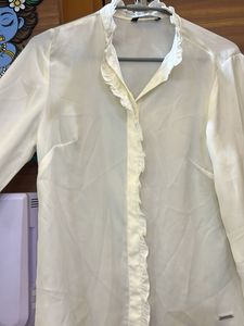Elegant Cream Top with Metal Detail