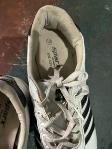 White Sneakers with Black Stripes