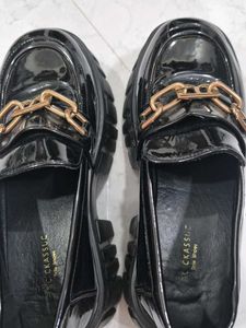 Chic Black Patent Loafers with Gold Chain Accent
