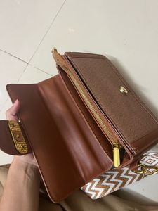 Chic Brown Crossbody Bag with Patterned Strap