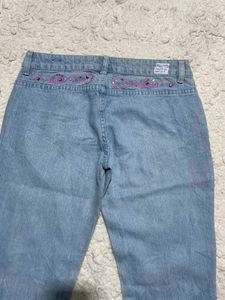 Light Wash Flared Jeans with Embellishments