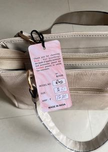Stylish Beige Textured Handbag with Butterfly Char