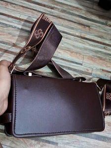 Stylish Brown Crossbody Bag with Monogram Strap