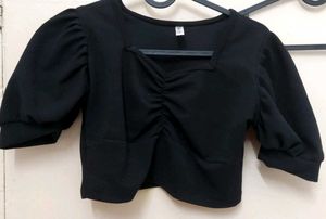 black crop top with bell sleeves