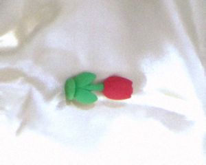 Red Tulip Show Case On Table Plus Eraser | Well