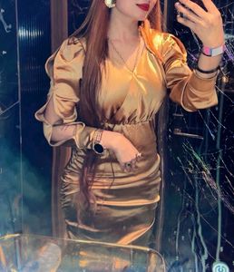 Elegant Gold Ruched Mini Dress look osm