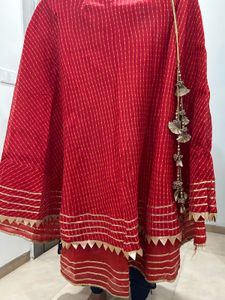 Red lehenga with matching dupatta and golden blous