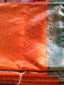 Vibrant Orange Saree with Blue & Silver Border