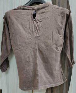 A Brown Top With Sleeves Detailing