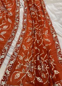 Embroidered brick colour saree