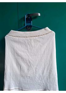 Elegant White Knit Top with Embellished Neckline
