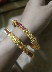 Elegant Gold Bangles with Red Accents